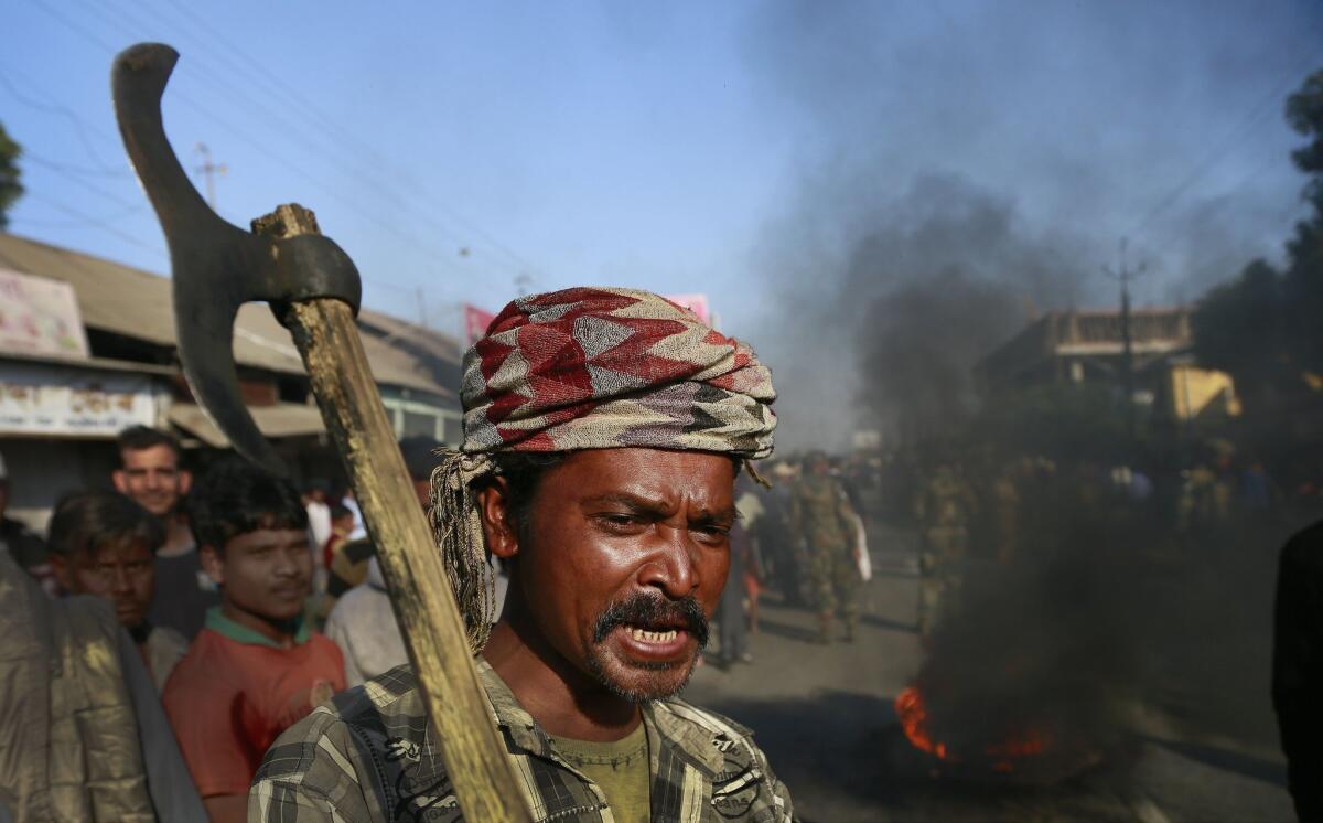 A tribal settler participates in a Dec. 24 protest in the village of Shamukjuli in the Indian state of Assam against an attack by an indigenous separatist group on villages in the area.
