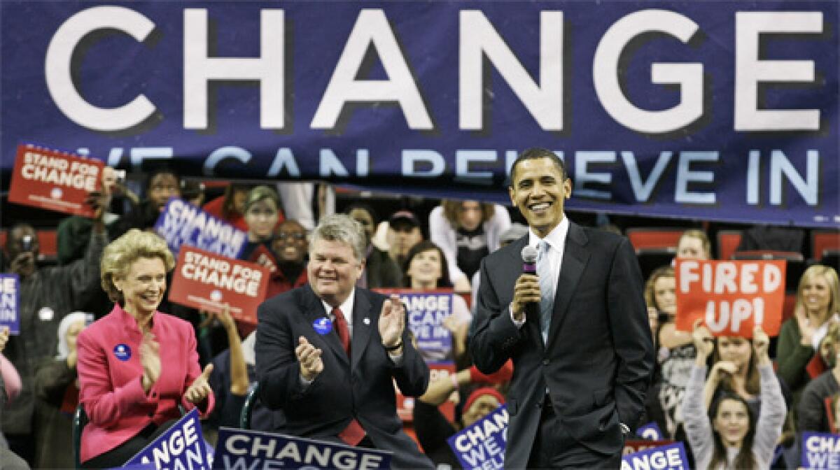 IN WASHINGTON STATE: Sen. Barack Obama (D-Ill.) campaigns with Gov. Chris Gregoire, left, and Seattle Mayor Greg Nickels, center, both of whom have endorsed him. Obamas organization believes support from local leaders has been key.