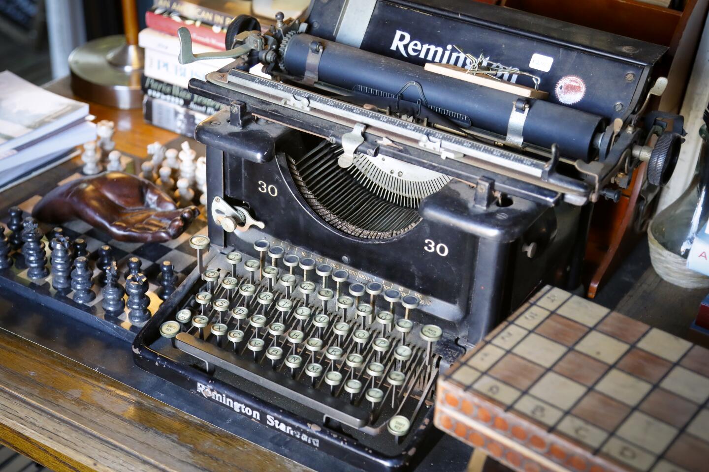 An old Remington typewriter is one of the many items at Lhooq Books, a funky vintage bookstore in Carlsbad Village. Sean Christopher, the owner recently received a 60-day eviction notice for both the shop and the adjoining house where he has raised his son, alone. He's hoping to achieve a stay of eviction on the property long enough to sell off his book inventory and find a new space without going bankrupt and ending up homeless with his son.