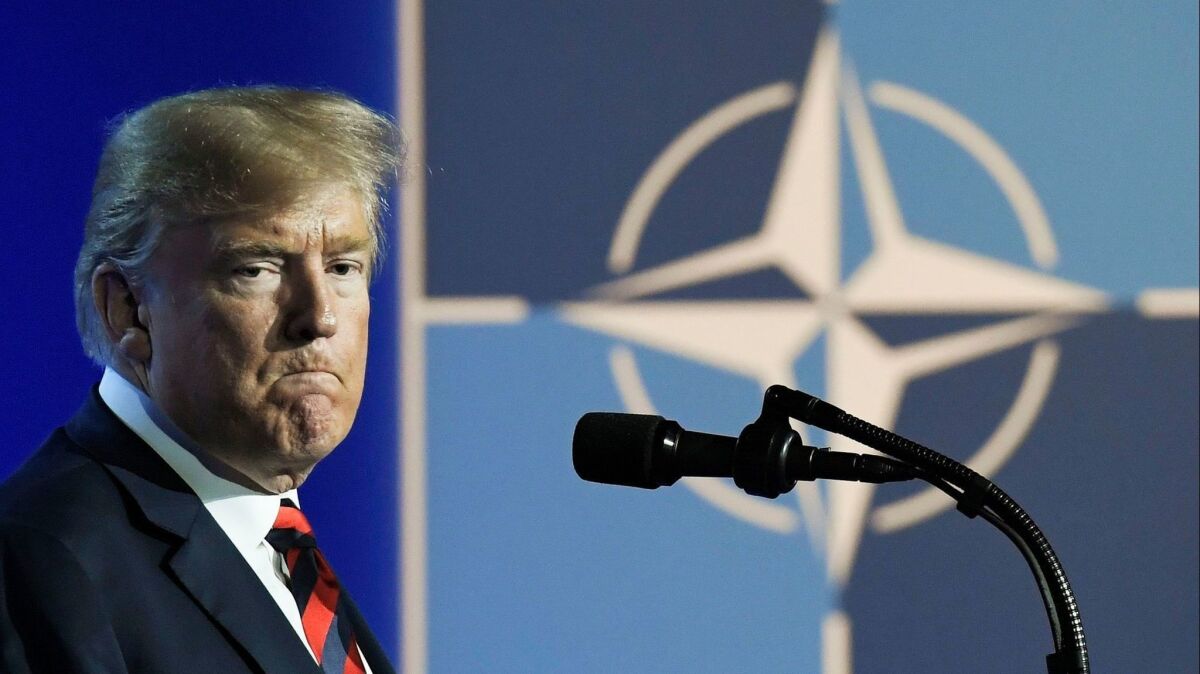 President Trump speaks at a news conference at the NATO summit in Belgium on July 12.
