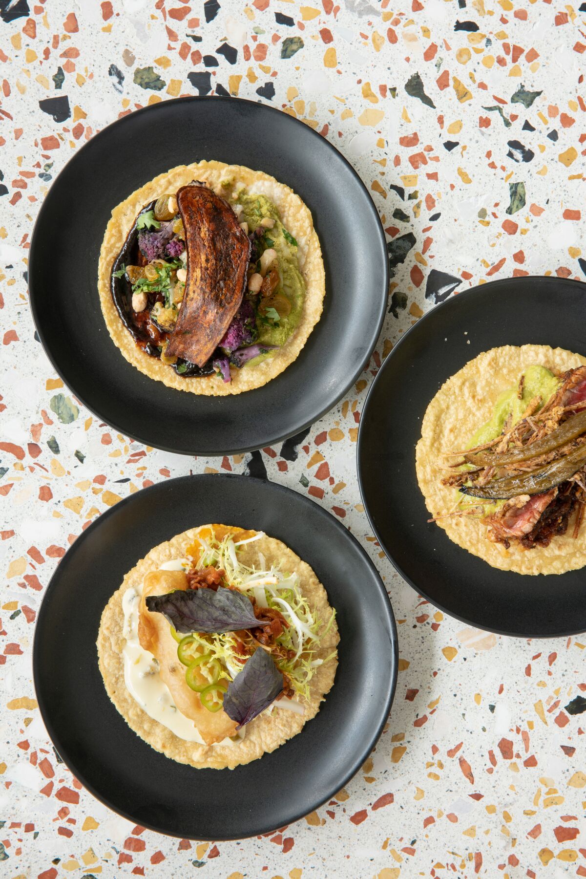 Take your date for a plate of elevated tacos at Lola 55.