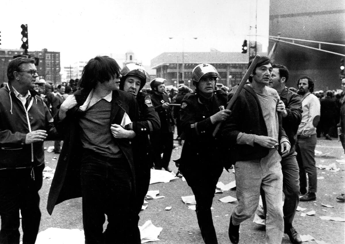 Howard Zinn arrested at a Vietnam War protest in the 1960s as seen in the film 'You Can't Be Neutral on a Moving Train.'