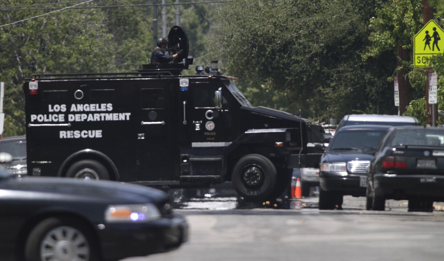 A man who led police on a high speed chase across L.A. freeways fled on foot into a North Hollywood neighborhood with a rifle. Police have locked down the area off Magnolia Boulevard near the 170 freeway.