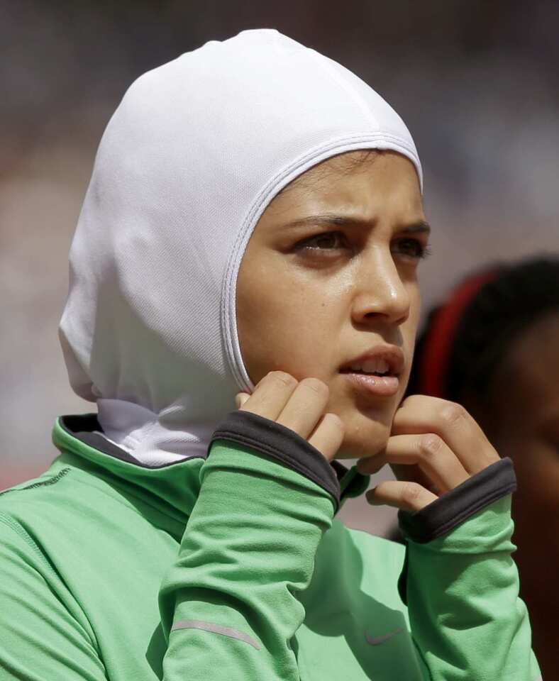 Saudi Arabia's Sarah Attar prepares to compete in an 800-meter heat during track and field competitions Wednesday. Attar made history as the first Saudi woman to compete in track events at the Olympic Games.