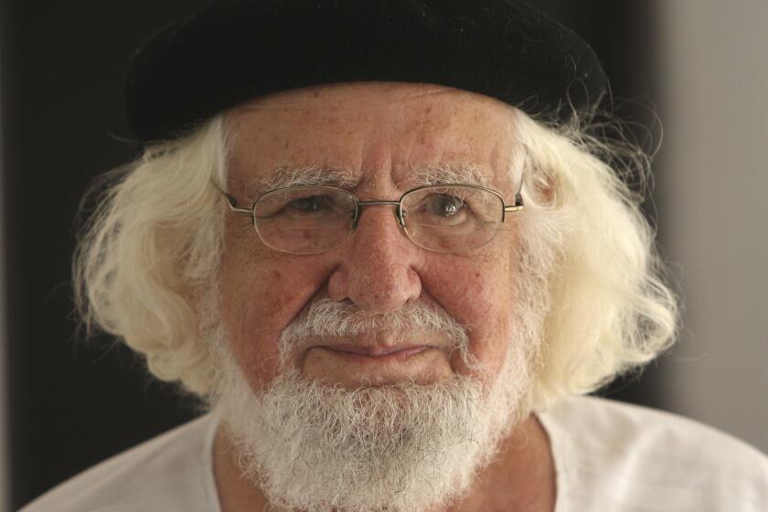 FILE - This Aug. 29, 2008 file photo shows Nicaraguan priest and poet Ernesto Cardenal in his home while under house arrest, in Managua, Nicaragua. Cardenal has died on Sunday, March 1, 2020, according to his personal assistant Luz Marina Acosta. (AP Photo/Esteban Felix, File)