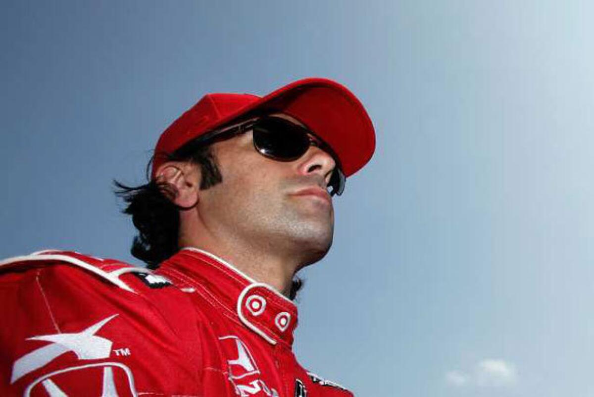 Dario Franchitti prepares to climb aboard his car during practice Friday for the Indianapolis 500.