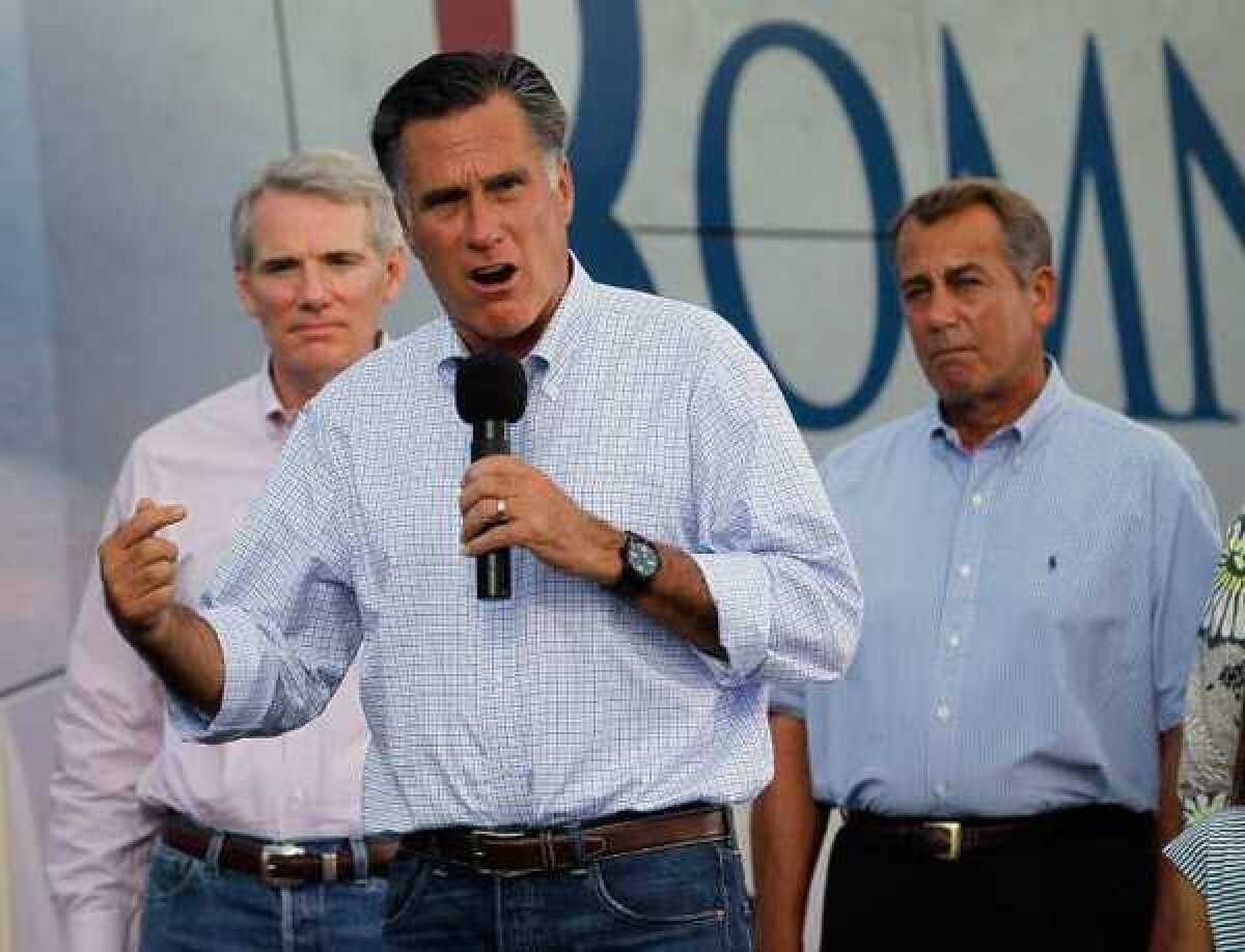 Mitt Romney, seen speaking at a campaign event in Ohio, wants to increase defense spending massively -- by more than 50% over current levels, according to one estimate. That could mean almost $2 trillion in additional military spending over 10 years.