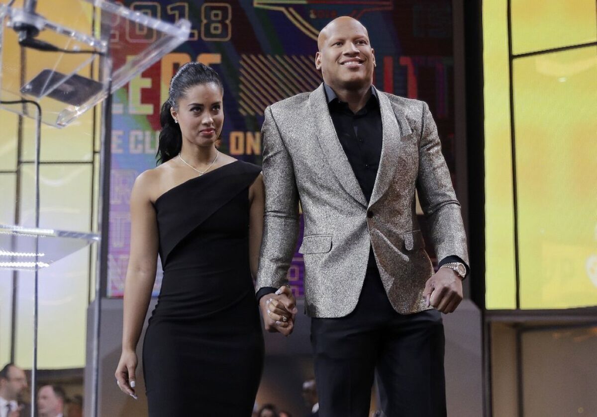 Ryan Shazier, right, walks with his wife, Michelle, to announce the Pittsburgh Steelers' selection in the first round.