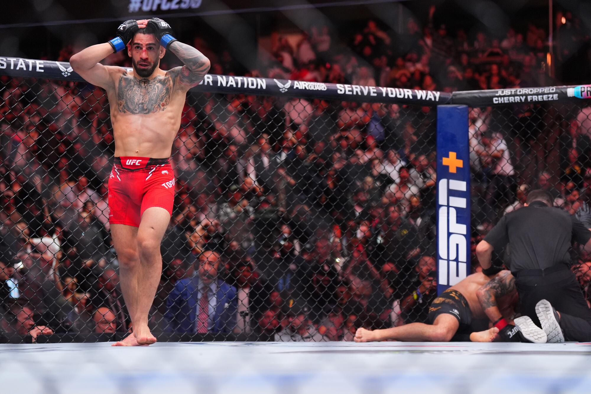 Ilia Topuria reacts immediately after his knockout victory over Alexander Volkanovski.