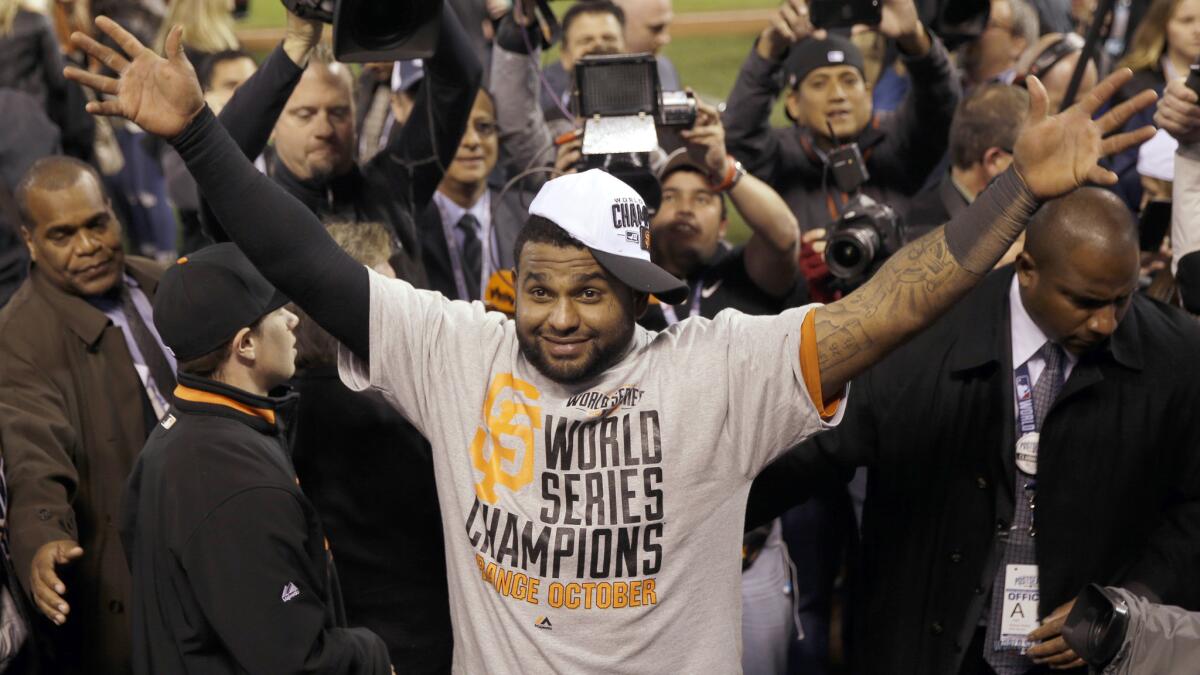 San Francisco Giants third baseman Pablo Sandoval celebrates the team's World Series victory over the Kansas City Royals.