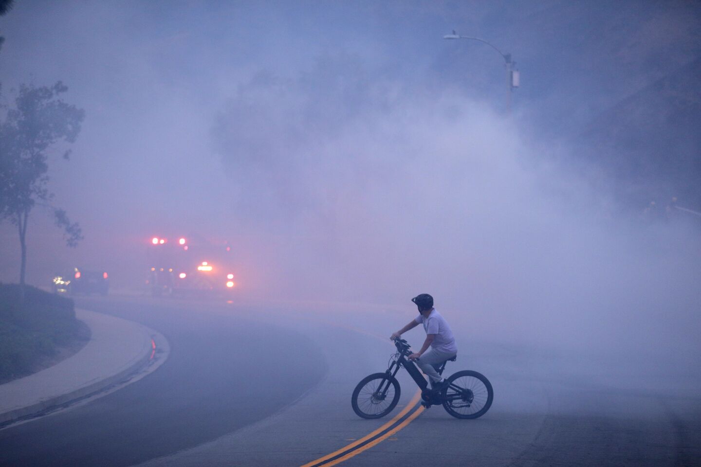 A cyclist amid smoke