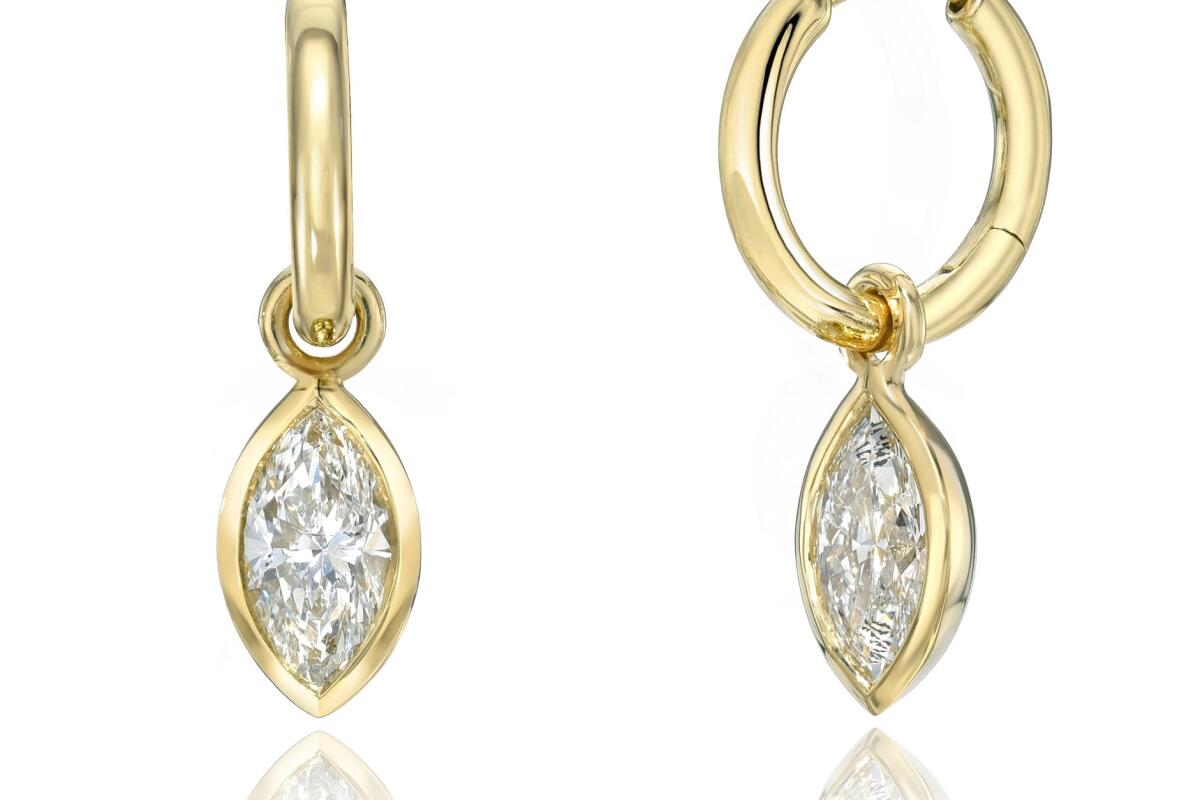 A pair like this, which are 18 karat gold charm hoops featuring marquise diamonds totaling 1 carat, were stolen