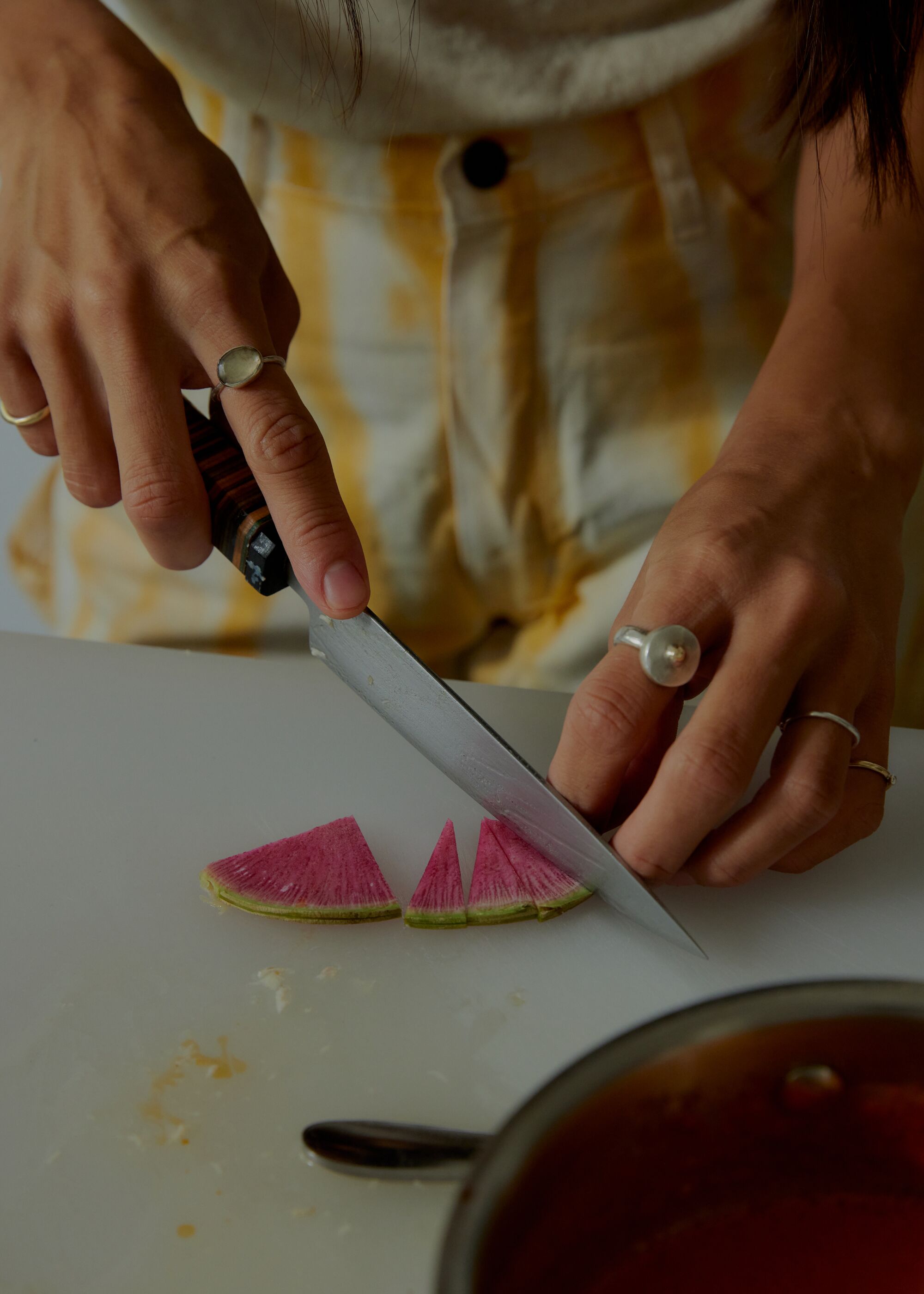 Watermelon radish, cut in petite triangles, as a topping for Ho's fish sauce congee.