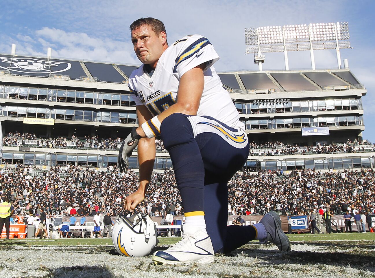 San Diego Chargers Philip Rivers takes a knee on the field after a 34-31 loss to the Raiders in Oakland on Oct. 9, 2016.