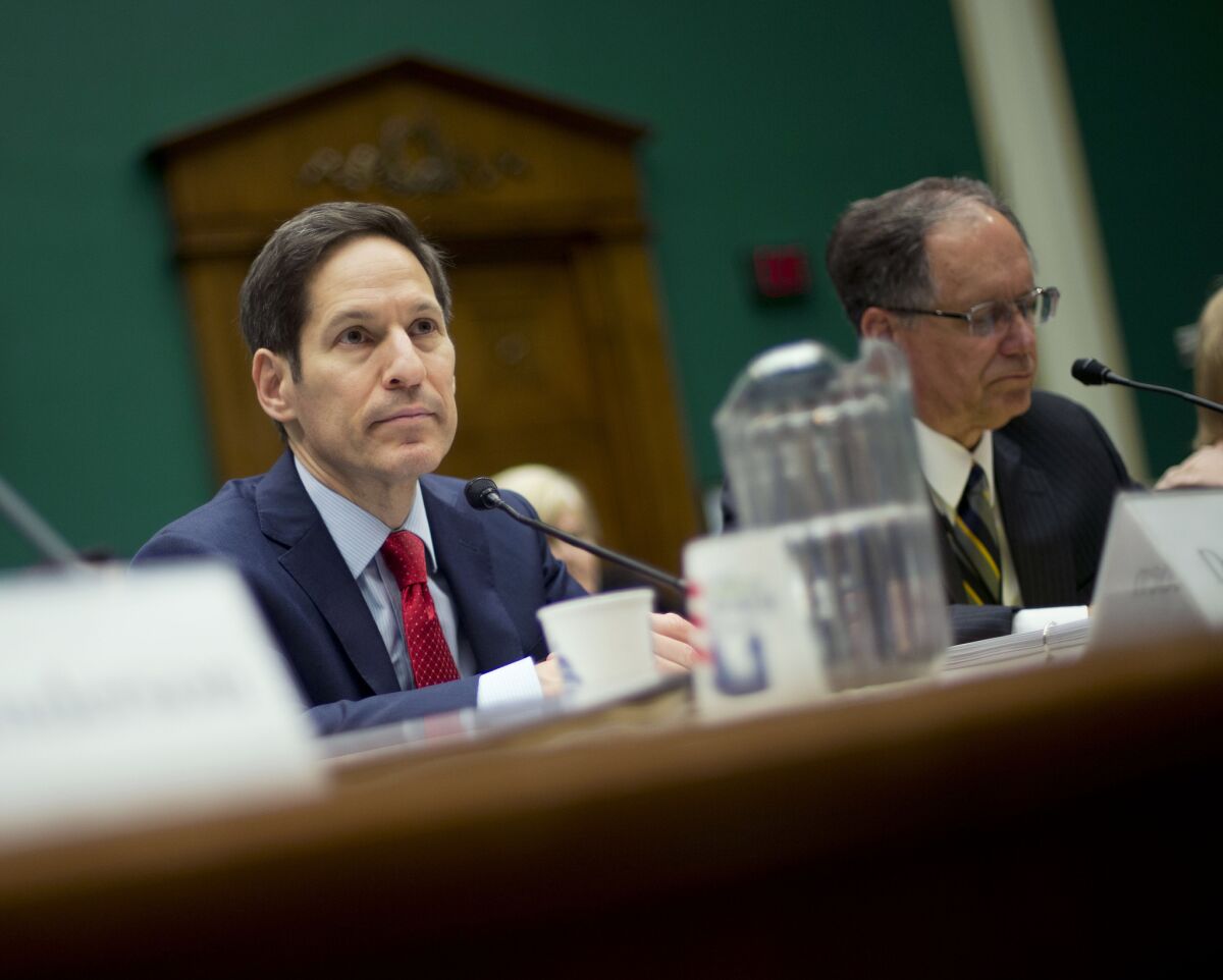 CDC Director Dr. Thomas Frieden, left, appears before a hearing of the House Energy and Commerce Committee. Frieden called recent safety lapses dealing with deadly pathogens "completely unacceptable" and vowed to make changes.