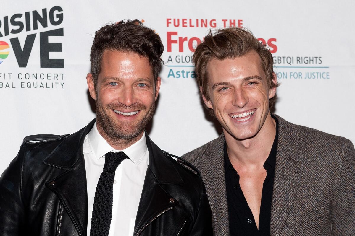 Nate Berkus, left, and Jeremiah Brent are now parents of a baby girl.