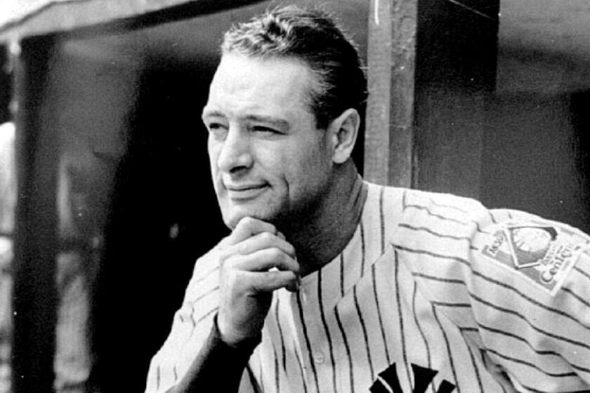 Lou Gehrig stands in the dugout at Yankee Stadium in 1939.