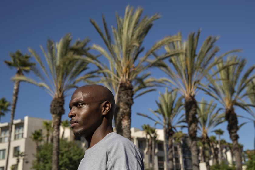 LOS ANGELES, CA -JULY 30, 2020: Roderick Thompson Sr. 35, who was released 9 months early from Avenal State Prison due to the coronavirus outbreak, is photographed outside of Union Station in downtown Los Angeles after arriving there this afternoon on an Amtrak bus. Thompson Sr. had been incarcerated at Avenal State Prison for the past 3 and 1/2 years and was released this morning. He took the train from Hanford to Bakersfield and the bus from Bakersfield to Union Station. (Mel Melcon / Los Angeles Times)