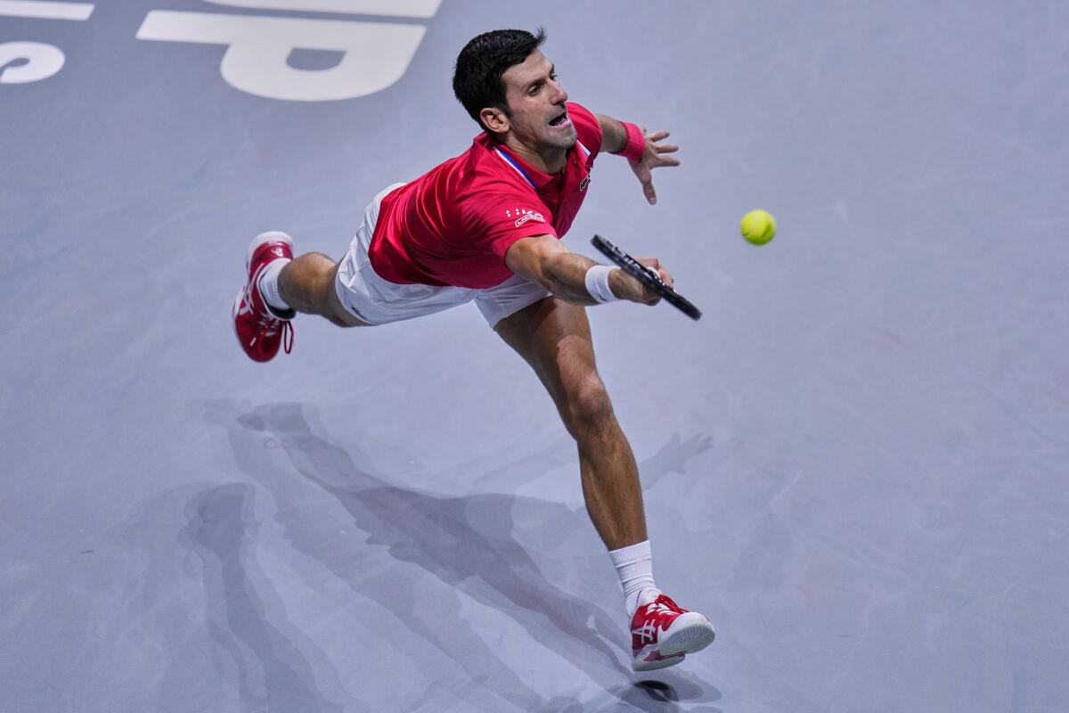 Serbia's Novak Djokovic returns the ball to Kazakhstan's Alexander Bublik during a Davis Cup quarter final match between Serbia and Kazakhstan at the Madrid Arena stadium in Madrid, Spain, Wednesday, Dec. 1, 2021. (AP Photo/Manu Fernandez)