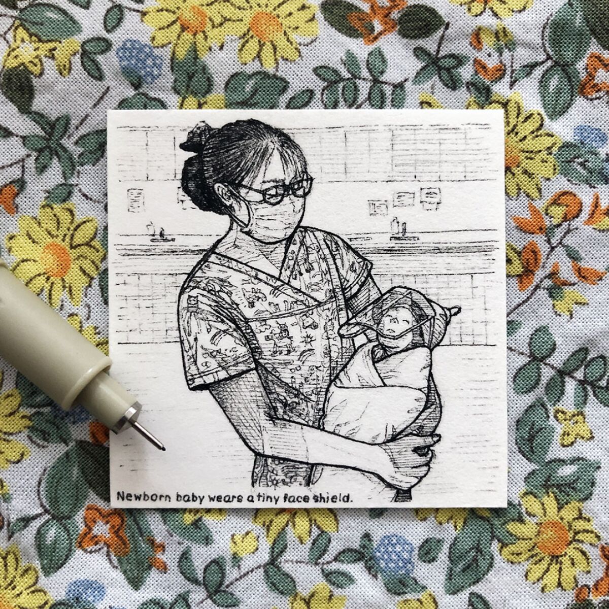 This drawing, titled Baby with Face Shield, was among Nara Lee's 100 pieces of tiny artwork.