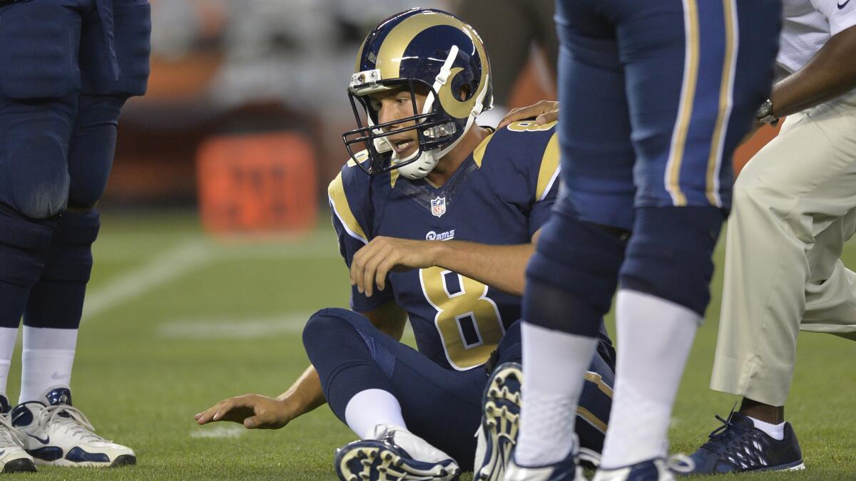 St. Louis Rams quarterback Sam Bradford sits on the field after tearing his left ACL during a preseason game against the Cleveland Browns on Saturday.