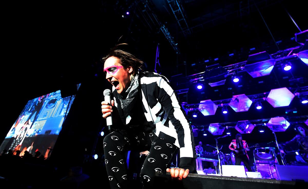 Win Butler performs with Arcade Fire at the Coachella Valley Music and Arts Festival in Indio. The band is opening a Haitian restaurant in Montreal.