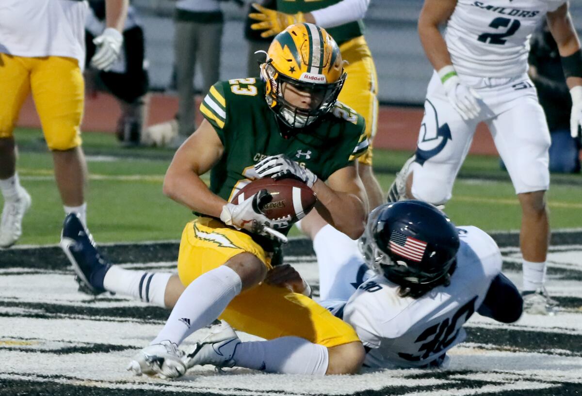 Nico Brown is shown catching a touchdown against Newport Harbor last March