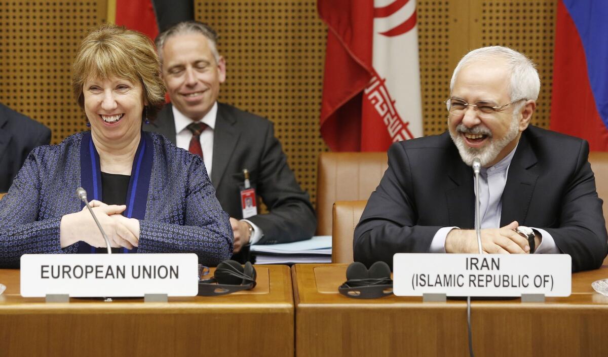 Vice President of the European Commission Catherine Ashton, left, and Iranian Foreign Minister Mohammad Javad Zarif smile while attending talks in Vienna aimed at reaching a deal on Iran's nuclear program.