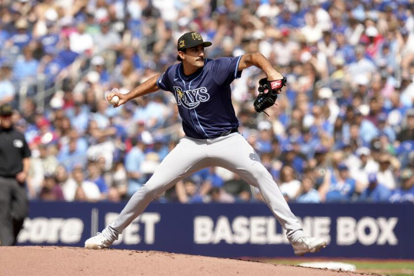 Tampa Bay Rays pitcher Zach Eflin (24) works against the Toronto Blue Jays during the first inning of a baseball game in Toronto, Saturday, May 18, 2024. (Chris Young/The Canadian Press via AP)