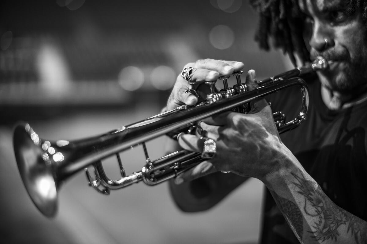 Photo of Lenny Kravitz playing the trumpet from "Paris Blues" exhibition at Leica Gallery Los Angeles, 2024