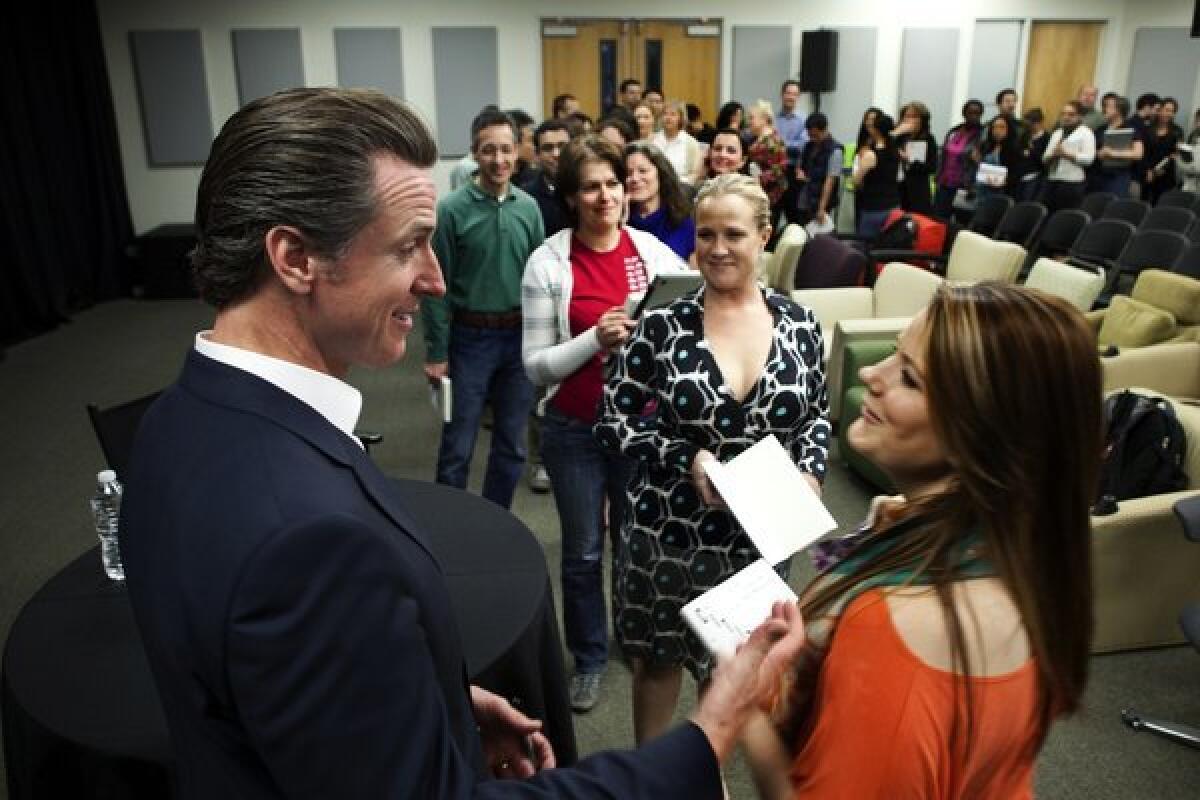 Lt. Gov. Gavin Newsom chats with Linkedin employees during a book-signing after being the guest speaker at an All Hands Meeting in Mountain View, Calif.