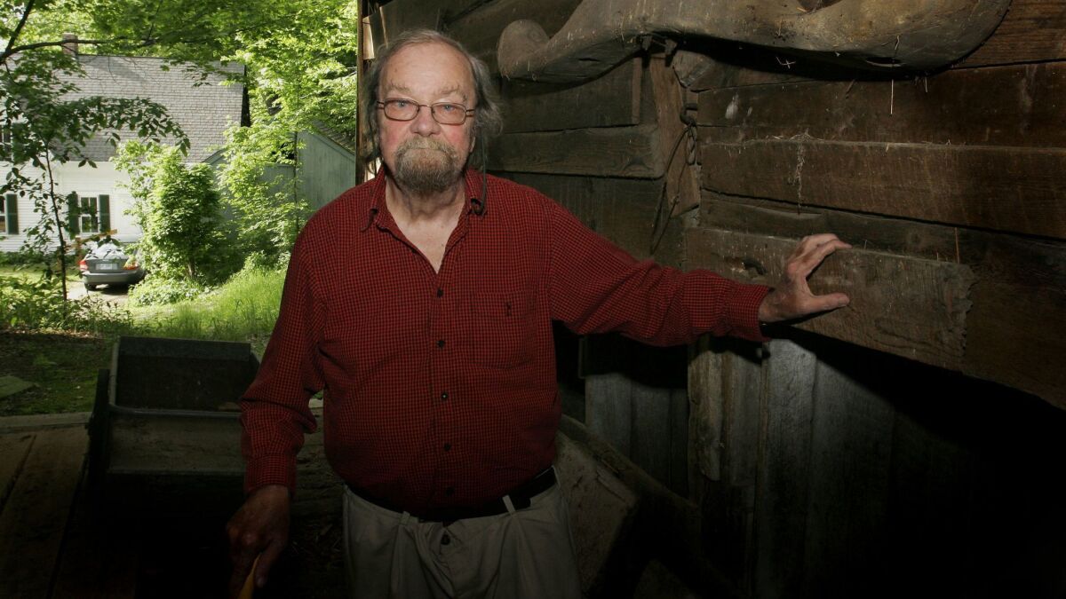 Donald Hall poses in the barn of the 200-year-old Wilmot farm that has been in his family for four generations on June 13, 2006.