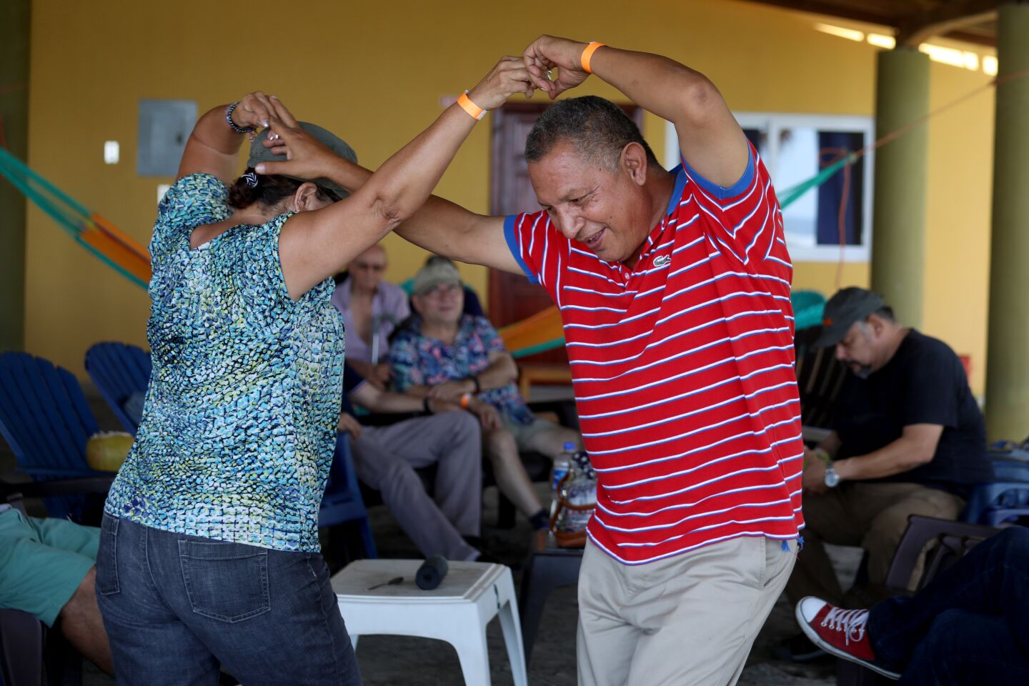 Rosa Elba Melendez of San Salvador dances with former classmate Dagoberto Lazo of San Miguel, El Salvador, while attending their 41st high school reunion in Usulutan.