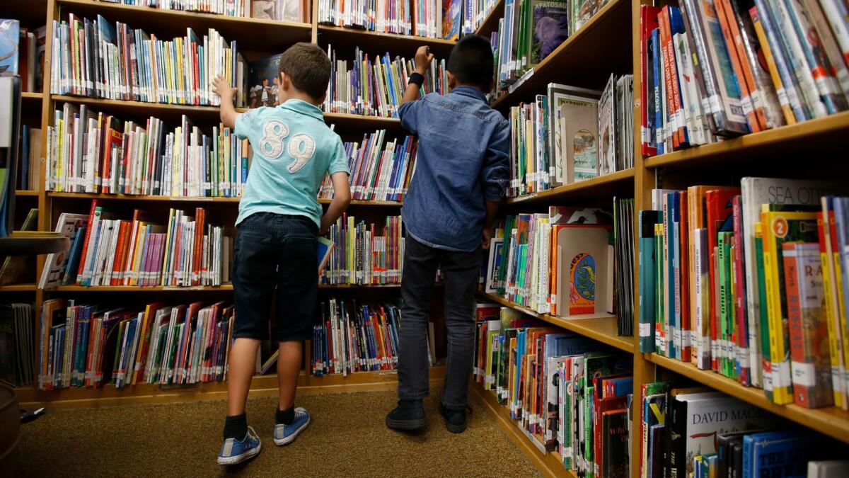 Second-graders Julian Gutierrez, 7, left, and Alex Sixtos, 8, at Meyler Street Elementary in Torrance.