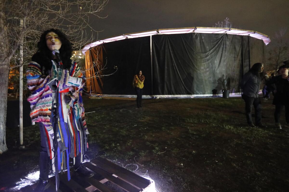 Micaela Tobin as Coyote performs in "Sweet Land," at Los Angeles State Historic Park on Feb. 21, 2020.