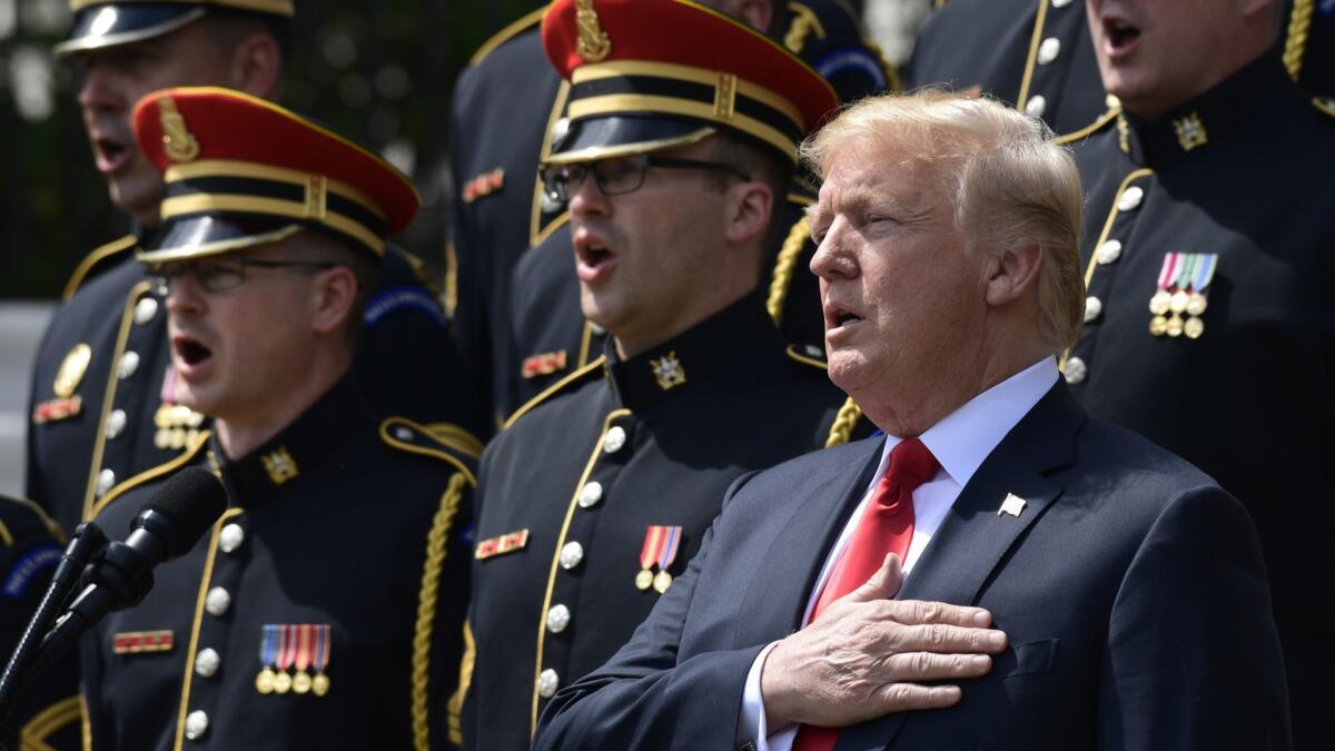 President Trump sings the national anthem during a "Celebration of America" at the White House on Tuesday held in lieu of an event with the Philadelphia Eagles.