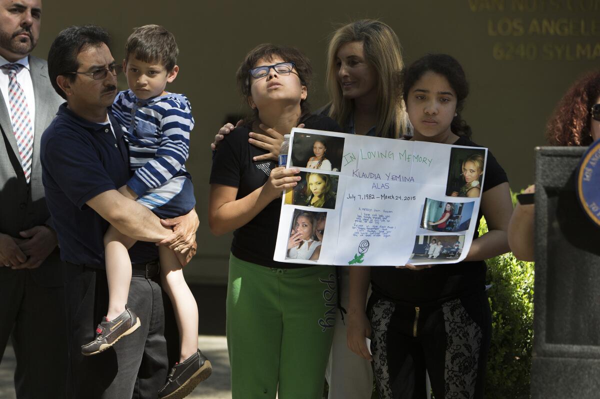 Relatives of Klaudia Yemina Alas attend a news conference announcing the arrest of Alas' boyfriend, Osmar Gomez, in her fatal stabbing. Alas, 32, was a mother of three.