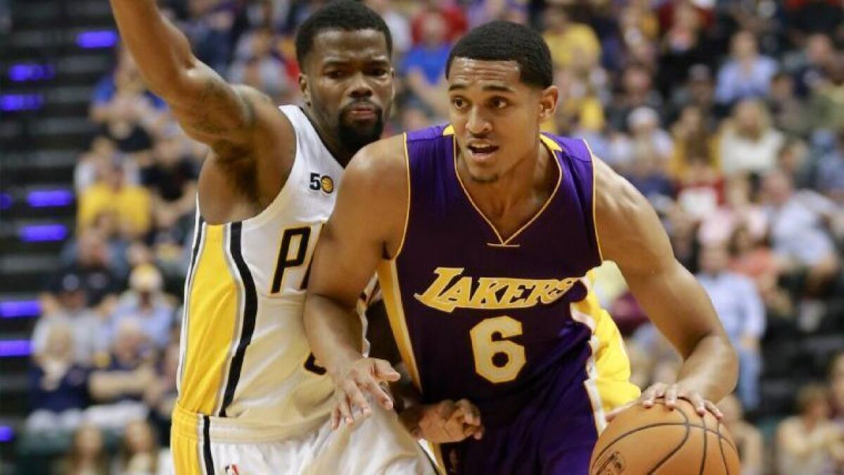 Lakers guard Jordan Clarkson (6) drives around Pacers guard Aaron Brooks during the first half on Nov. 1. (AP Photo/)