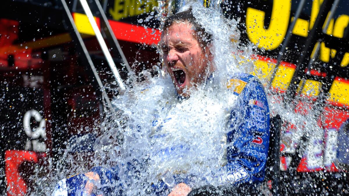 NASCAR Sprint Cup driver Brian Vickers participates in the ALS Ice Bucket Challenge following a practice session at Michigan International Speedway on Saturday.