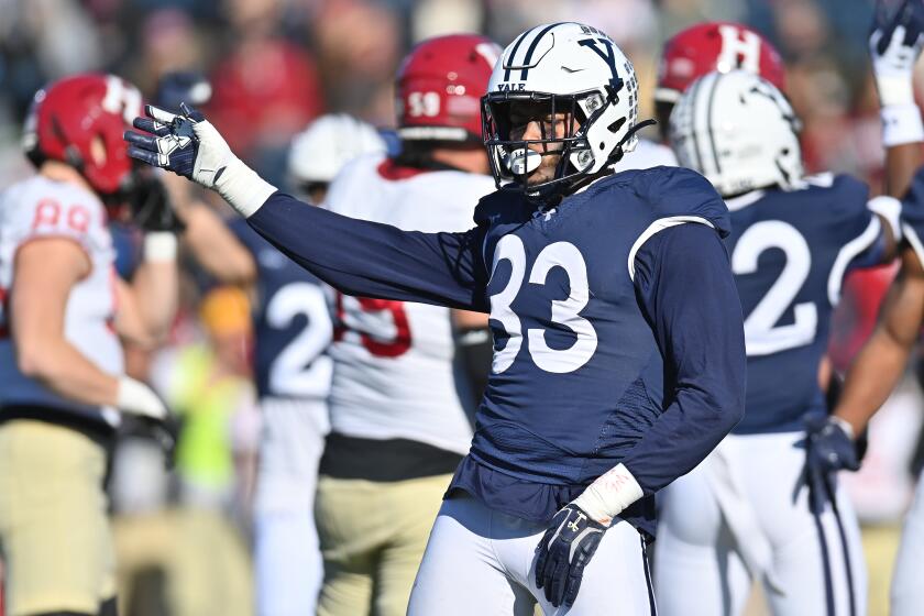 NEW HAVEN, CT - NOVEMBER 18:Yale Bulldogs defensive lineman Ezekiel Larry (33) celebrates after the play during the game as the Harvard Crimson take on the Yale Bulldogs on November 18, 2023 at the Yale Bowl, Class of 1954 Field in New Haven, CT (Photo by Williams Paul/Icon Sportswire via Getty Images)