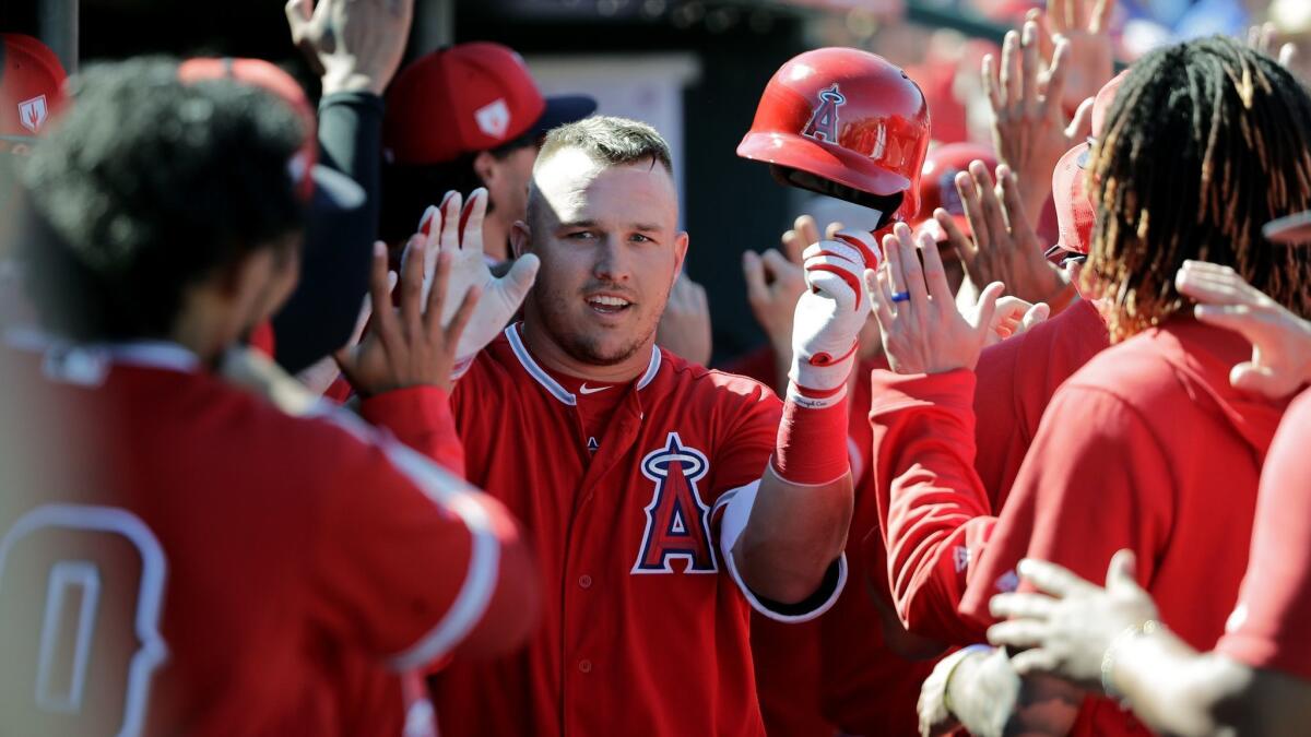 Angels' Mike Trout, center, is congratulated on his three-run home run during a spring training game against the Chicago Cubs on March 5.