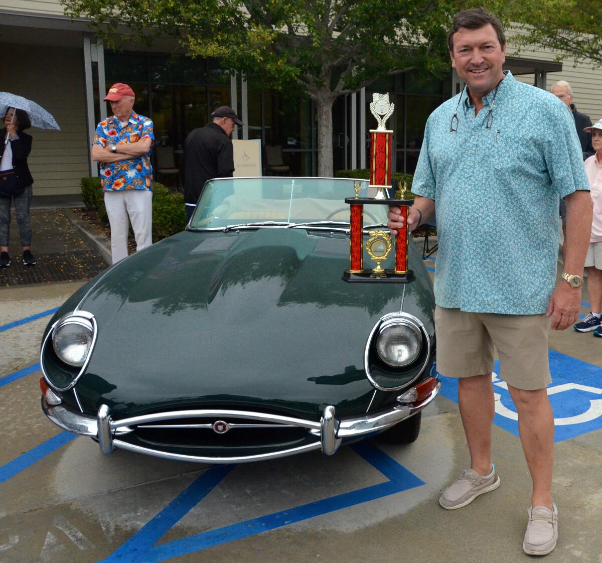 Tim Roberts holds the Best of Show award, for his 1968 Jag-E.