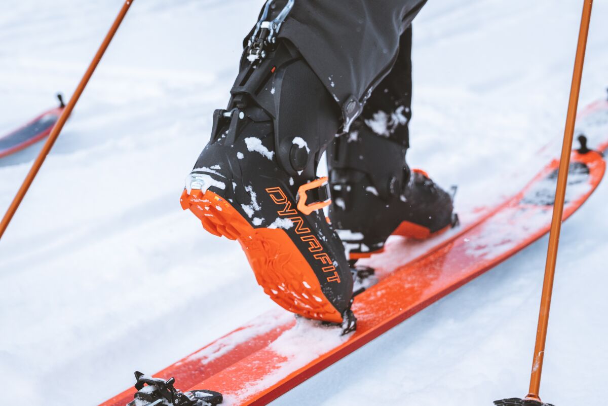 Uphill skiers use skis that allow them to lift their heel to trek up the slope.