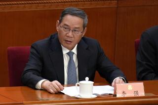 Chinese Premier Li Qiang attends the opening session of the Chinese People's Political Consultative Conference held at the Great Hall of the People in Beijing, Monday, March 4, 2024. The Chinese government says it is eliminating an annual news conference by the premier that was one of the only times a top Chinese leader took questions from the news media. (AP Photo/Ng Han Guan)