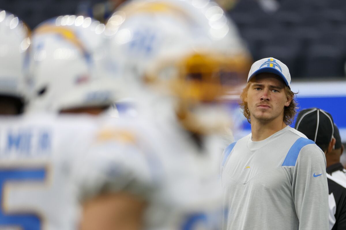 Chargers quarterback Justin Herbert looks on during a preseason game against the Rams in August.