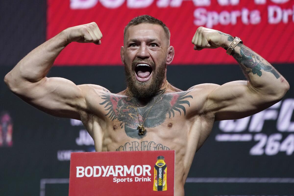 Conor McGregor poses during a ceremonial weigh-in for a UFC 264 mixed martial arts bout Friday, July 9, 2021, in Las Vegas.