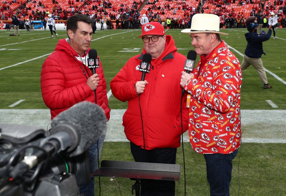 Kansas City fans and actors, from left, Rob Riggle, Eric Stonestreet and David Koechner stand on the sideline before a Chiefs game against the Chargers on Dec. 29 at Arrowhead Stadium.