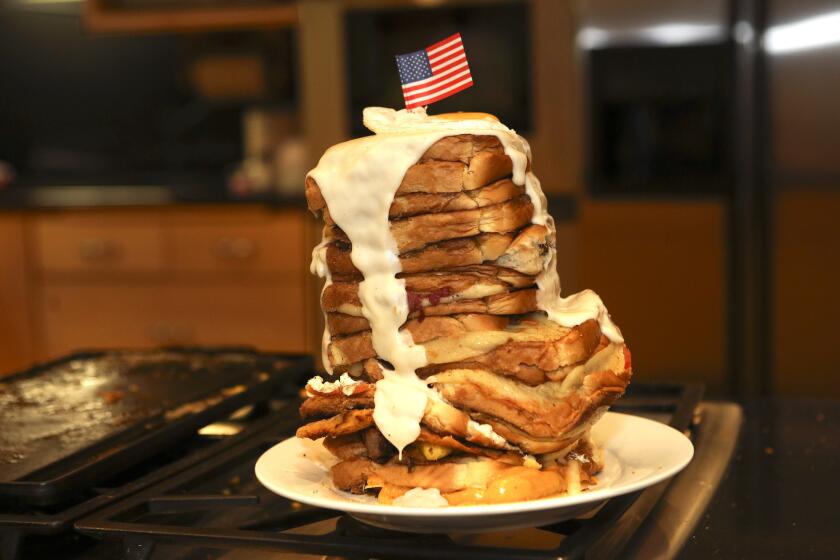 Twenty layers of grilled cheese goodness, topped with bechamel sauce and a fried egg. And the American flag, of course.