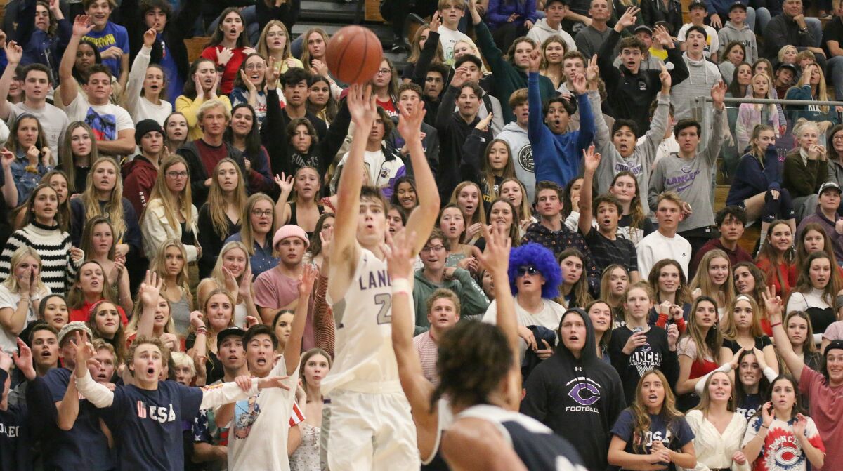 Carlsbad fans hang on result of Caleb Nelson's three-pointer.