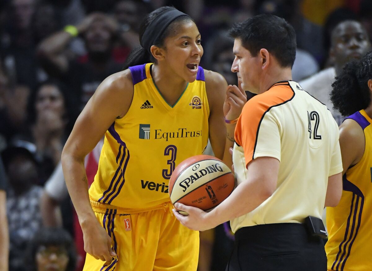 Sparks forward Candace Parker complains about a call to referee Roy Gulbeyan during the second half in Game 4 of the WNBA Finals on Sunday.